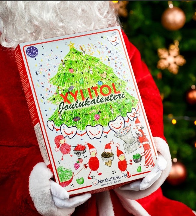 Father Christmas holding a xylitol Advent calendar.